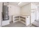 Garage work area featuring a work bench with storage and access to the water heater at 6988 W Monte Lindo --, Glendale, AZ 85310