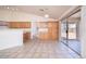 Open kitchen and dining area with tile floors and outdoor access at 6988 W Monte Lindo --, Glendale, AZ 85310