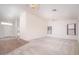 Bright living room with carpet, ceiling fan, and abundant natural light at 6988 W Monte Lindo --, Glendale, AZ 85310