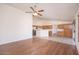 Open floor plan with hardwood and tile flooring connecting the kitchen and living areas at 6988 W Monte Lindo --, Glendale, AZ 85310