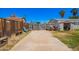 An expansive backyard showing a rustic wooden fence leading to a concrete parking area at 7011 W Carol Ann Way, Peoria, AZ 85382