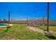 An open backyard featuring a cozy firepit, string lights, and inviting seating area at 7011 W Carol Ann Way, Peoria, AZ 85382