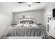 Comfortable bedroom with a decorative bed frame, soft lighting, and neutral wall paint at 7011 W Carol Ann Way, Peoria, AZ 85382