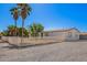 Attractive single-story home featuring a secure white picket fence and desert landscaping at 7011 W Carol Ann Way, Peoria, AZ 85382