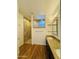 Bathroom featuring a walk-in shower with custom tilework and a decorative glass panel at 7111 S 21St Dr, Phoenix, AZ 85041