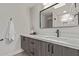 Modern bathroom boasts quartz countertops, gray cabinets, and black hardware at 7962 E San Miguel Ave, Scottsdale, AZ 85250