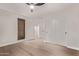 Light and bright bedroom features wood floors, closet and backyard views at 7962 E San Miguel Ave, Scottsdale, AZ 85250