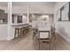 Open dining room with modern table and chairs, light wood floors, and decorative wall art at 7962 E San Miguel Ave, Scottsdale, AZ 85250