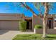 Charming single-level home featuring a two-car garage and beautifully landscaped front yard at 7962 E San Miguel Ave, Scottsdale, AZ 85250
