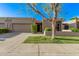 Charming single-level home featuring a two-car garage and nicely kept front yard at 7962 E San Miguel Ave, Scottsdale, AZ 85250