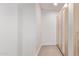 Hallway features wood floors and built in storage with natural wood doors at 7962 E San Miguel Ave, Scottsdale, AZ 85250