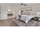 Tranquil main bedroom with ensuite bathroom, neutral colors, and a ceiling fan at 7962 E San Miguel Ave, Scottsdale, AZ 85250