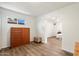 Bedroom area featuring wood-look flooring, natural light, and closet at 8042 N 28Th Ave, Phoenix, AZ 85051