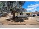 Charming single-story home with a large tree, inviting curb appeal, and a well-maintained exterior at 8042 N 28Th Ave, Phoenix, AZ 85051