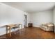 Bright room with chair, wood desk, and stained concrete floor at 8042 N 28Th Ave, Phoenix, AZ 85051