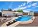 Backyard features a refreshing pool, a diving board, and a patio seating area for outdoor relaxation at 8042 N 28Th Ave, Phoenix, AZ 85051
