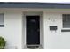 Charming front door with a black security door, mailbox, and house number 845 at 845 N Los Alamos Dr, Goodyear, AZ 85338