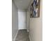 This hallway features light walls and gray flooring at 845 N Los Alamos Dr, Goodyear, AZ 85338