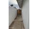 Exterior view down side yard featuring a block wall and metal gate at 845 N Los Alamos Dr, Goodyear, AZ 85338