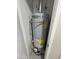 AO Smith water heater inside a closet with energy guide sticker and copper pipes at 845 N Los Alamos Dr, Goodyear, AZ 85338