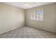 A bright bedroom with plantation shutters, neutral paint, carpet, and a ceiling fan at 9012 E Sutton Dr, Scottsdale, AZ 85260