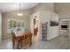 Cozy dining room showcasing a rustic wooden table and chairs, and bright natural light at 9012 E Sutton Dr, Scottsdale, AZ 85260