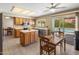 Well-lit kitchen featuring wood cabinets, stainless steel appliances, an island, and a breakfast nook at 9012 E Sutton Dr, Scottsdale, AZ 85260