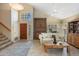Bright and airy living room with tile floors, a vaulted ceiling, and a comfortable seating area at 9012 E Sutton Dr, Scottsdale, AZ 85260