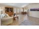 Inviting living room featuring neutral tones, tile flooring, and views to the dining area at 9012 E Sutton Dr, Scottsdale, AZ 85260