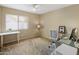 Bright office space with modern desk and ample natural light from a large window at 9012 E Sutton Dr, Scottsdale, AZ 85260
