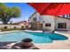 Backyard pool and outdoor seating area perfect for entertaining guests and enjoying outdoor relaxation at 9012 E Sutton Dr, Scottsdale, AZ 85260