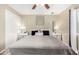 Inviting bedroom with neutral tones, carpet, ceiling fan, and bedside tables at 9028 W Osborn Rd, Phoenix, AZ 85037