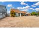 Single-story home with a carport, neutral paint, minimal landscaping, and a concrete driveway at 9028 W Osborn Rd, Phoenix, AZ 85037