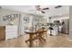 Open kitchen/dining area boasts white cabinets, stainless steel appliances, and backyard access at 9028 W Osborn Rd, Phoenix, AZ 85037