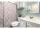 Charming bathroom featuring a floral shower curtain, vanity, and decorative mirror at 9333 E University Dr # 83, Mesa, AZ 85207