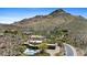Spectacular aerial view of desert home featuring a pool and scenic mountain backdrop at 11334 E Troon Vista Dr, Scottsdale, AZ 85255