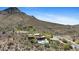 Majestic desert home featuring a pool and picturesque desert landscape at 11334 E Troon Vista Dr, Scottsdale, AZ 85255