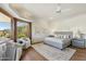 Comfortable bedroom with natural light, neutral tones, hardwood floors, and desert views for a peaceful retreat at 11334 E Troon Vista Dr, Scottsdale, AZ 85255