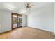Bright bedroom with hardwood floors and sliding door to outdoor covered living space at 11334 E Troon Vista Dr, Scottsdale, AZ 85255