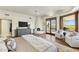Comfortable bedroom featuring hardwood floors, a fireplace, and views through windows and sliding glass door at 11334 E Troon Vista Dr, Scottsdale, AZ 85255