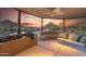 A covered patio with built-in seating and scenic mountain views at 11334 E Troon Vista Dr, Scottsdale, AZ 85255
