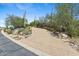 Long driveway lined with desert landscaping at 11334 E Troon Vista Dr, Scottsdale, AZ 85255