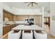 Bright kitchen with light wood cabinets, marble countertops, a large island with seating, and modern appliances at 11334 E Troon Vista Dr, Scottsdale, AZ 85255