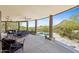 Inviting outdoor patio with desert views, stylish seating, and sturdy wooden columns enhance the scenic experience at 11334 E Troon Vista Dr, Scottsdale, AZ 85255
