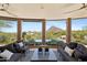 Relaxing outdoor living space featuring scenic views and comfortable seating on the stylish covered patio at 11334 E Troon Vista Dr, Scottsdale, AZ 85255