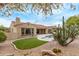 Expansive backyard boasts desert landscaping, putting green and a sparkling pool at 12906 W Oyer Ln, Peoria, AZ 85383