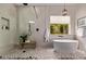 Beautiful bathroom featuring a soaking tub, and spacious walk-in shower with seating at 12906 W Oyer Ln, Peoria, AZ 85383