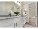 Stylish bathroom featuring a double sink vanity with modern fixtures and decor at 12906 W Oyer Ln, Peoria, AZ 85383