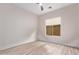 Minimalist bedroom featuring a bright window and light wood flooring at 12906 W Oyer Ln, Peoria, AZ 85383