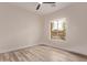 Bright bedroom featuring wood floors and a window with neighborhood views at 12906 W Oyer Ln, Peoria, AZ 85383
